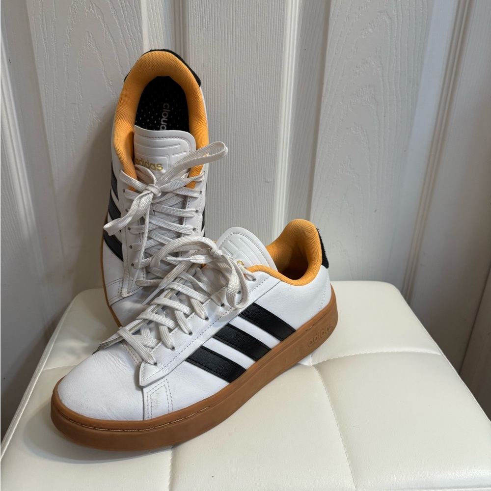 White and Black Sneakers with Orange Accents